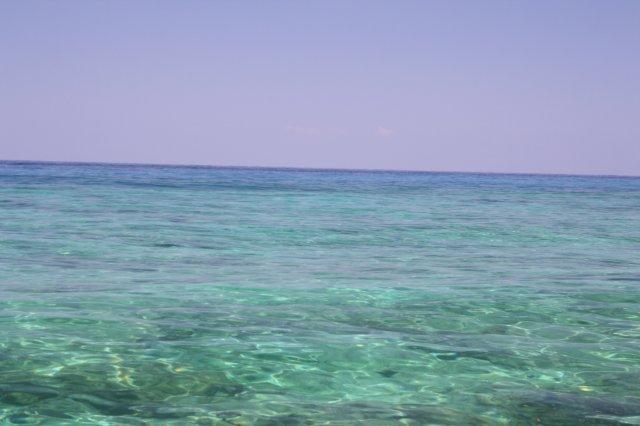 It's a weird thing to be floating over coral reefs in crystal clear water only a few feet deep in the middle of the Indian Ocean