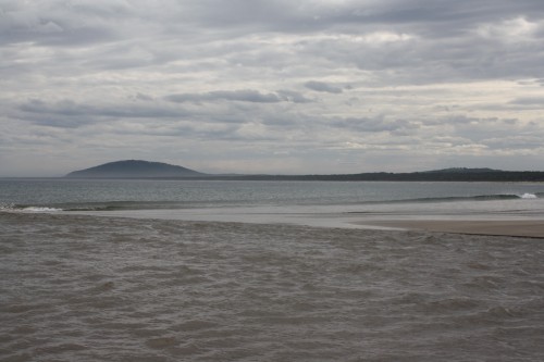 Seven Mile Beach on a moody day with the Crooked River flowing in the foreground