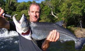 Extreme fish handling by Robson Green - I guess we should be grateful he didn't shoot it with a bow and arrow !