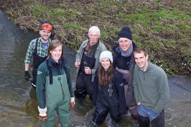 A happy band of habitat volunteers working under the guidance of Andy Thomas from the Wild Trout Trust