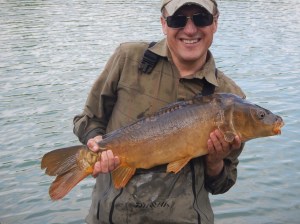 Charles Walker MP quickly got the hang of feeding the carp into casting range and landed several fine fish