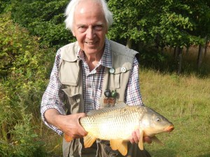 Fly fishing legend Brian Clarke  with a well earned fly caught carp. 
